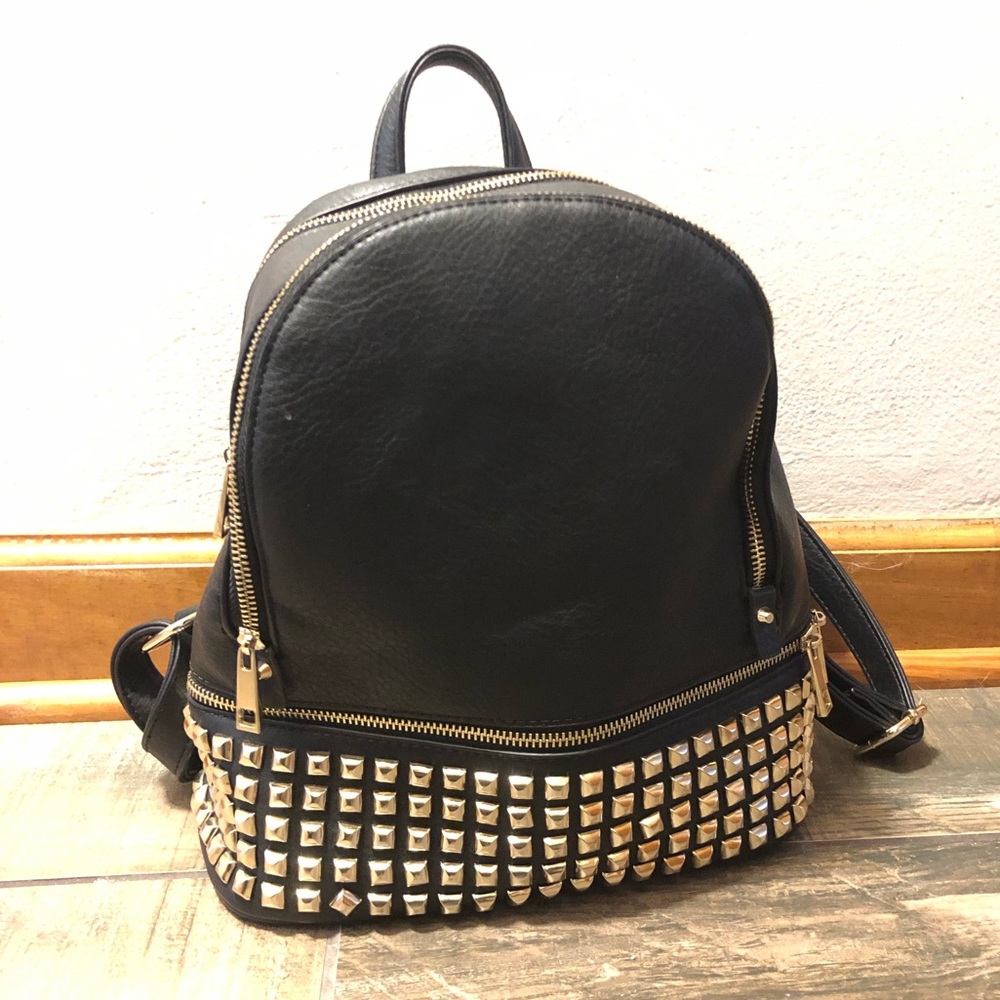 Black and gold studded backpack